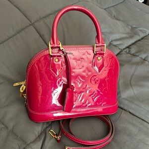 Louis Vuitton Alma BB rare raspberry color vernis crossbody bag.